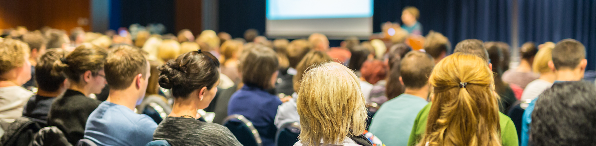 Large crowd listening to speaker